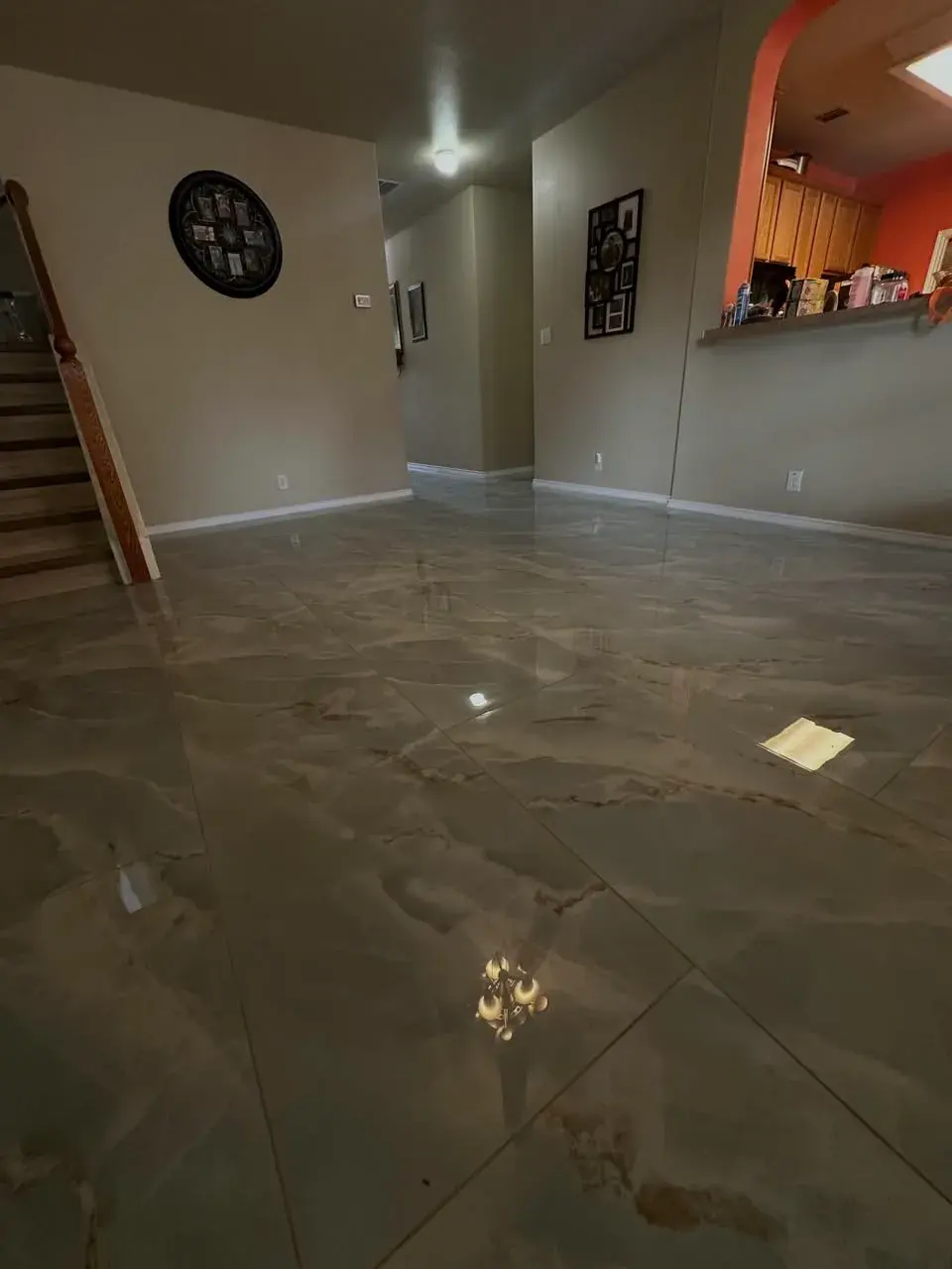 Finished living room with completed stone-look tile floor