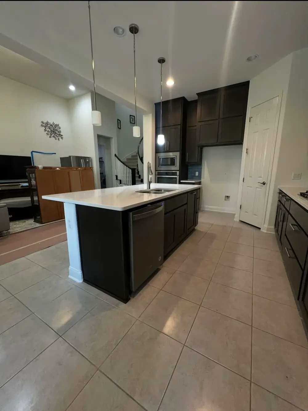 Finished kitchen rebuild with island and tile floor