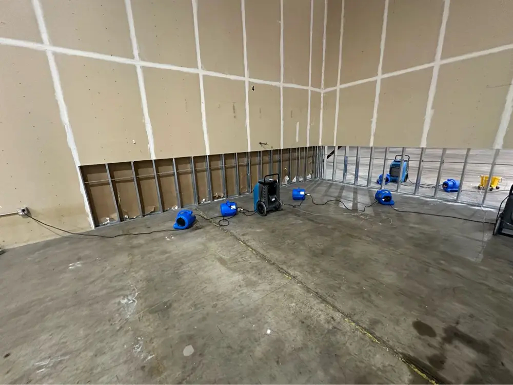 Warehouse walls flood-cut with drying equipment — commercial water loss