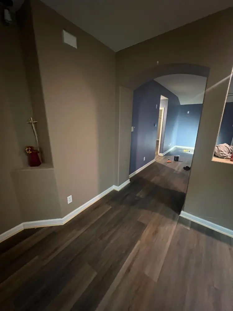 Finished hallway arches with new flooring and paint