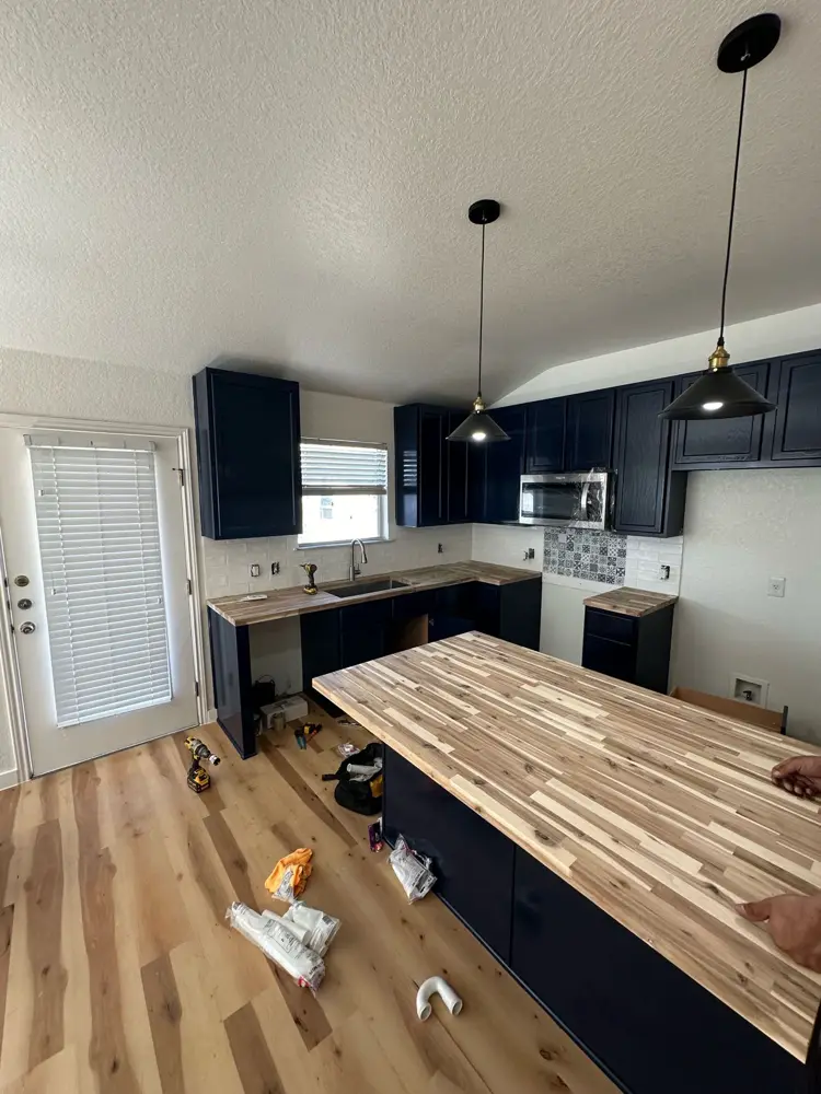 Kitchen build-back with butcher-block island in progress